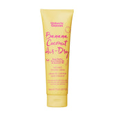 Umberto Giannini Banana Coconut Air Dry Cream bottle pour for lightweight styling.