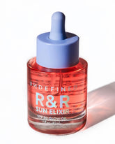 Undefined Beauty R&R Sun Elixir bottle closeup with SPF 30 and rose-vanilla scent