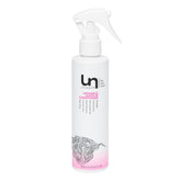 Unwash Untangle bottle pour showing easy detangling and hydration
