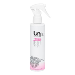 Unwash Untangle bottle pour showing easy detangling and hydration