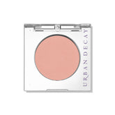 Urban Decay 24/7 Eyeshadow Single Introvert peach matte swatch shows vibrant, crease-free color.