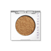 Urban Decay Dumb Luck warm copper metallic swatch for radiant, long-lasting lids.