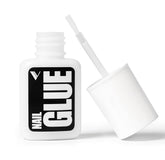 V Beauty Pure nail glue bottle close-up with precision brush for clean edges.