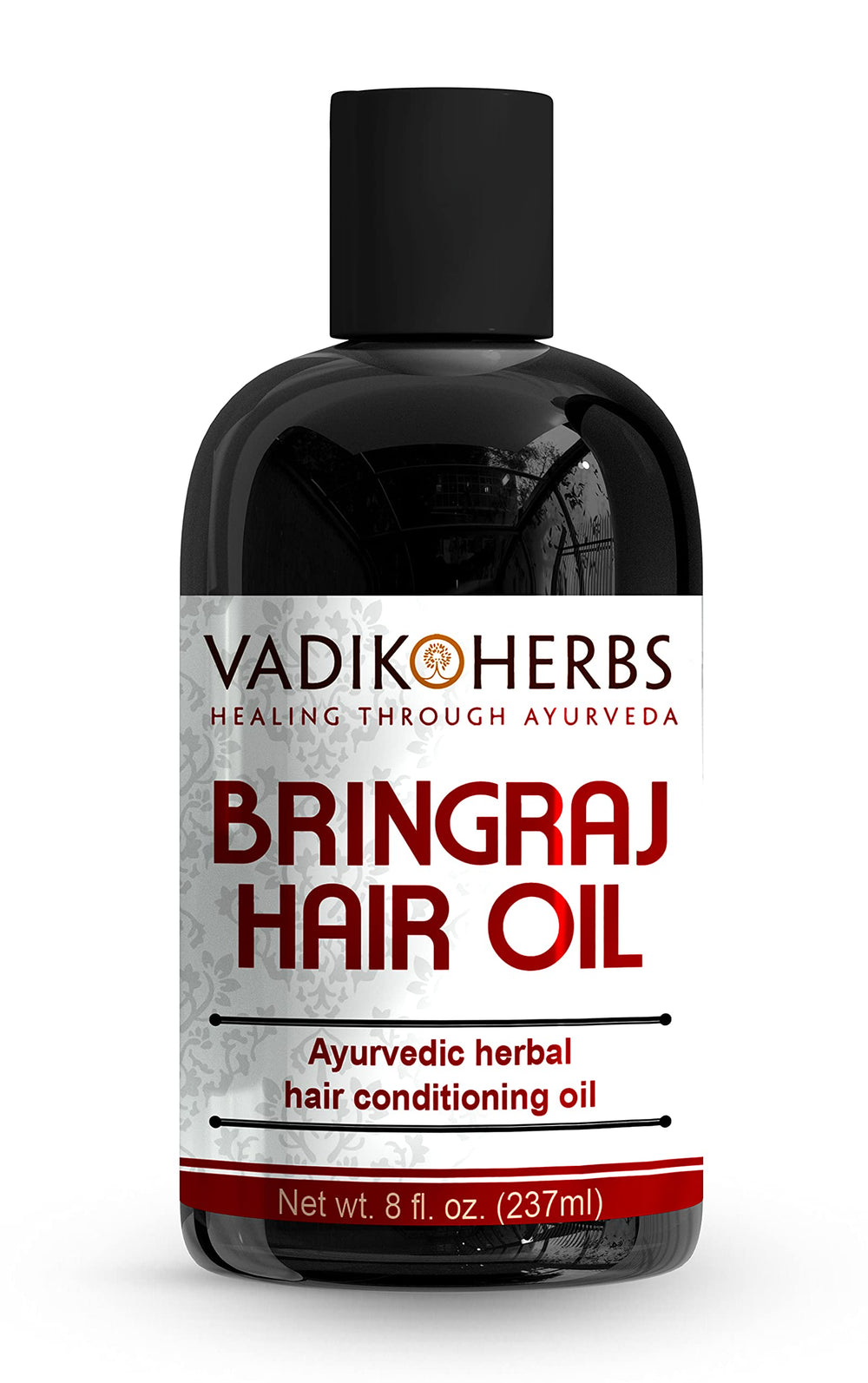 Vadik Herbs Bringraj Oil bottle pour demonstrates nourishing Ayurvedic care for hair and scalp.