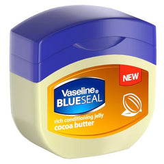 Vaseline Cocoa Butter Rich Conditioning Jelly close-up texture on skin, smoothing dry patches.
