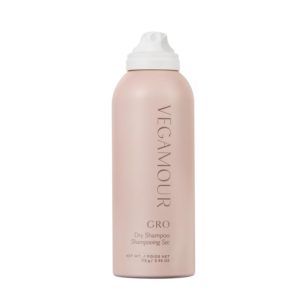 VEGAMOUR GRO Dry Shampoo bottle demonstrates oil absorption for refreshed roots and volume.