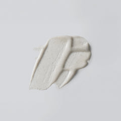 Versed Buff It Out texture closeup highlights microfine pumice for smoother skin.