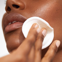 Versed Weekend Glow four-acid complex label promotes clarity on skin.