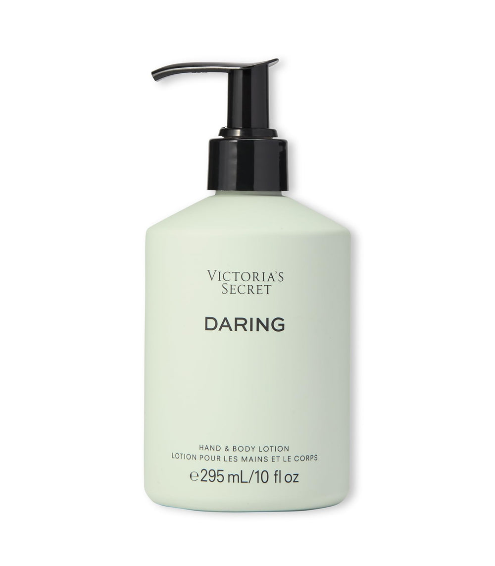 Victoria's Secret Daring fragrance body lotion bottle front with amber woody scent for daily wear.