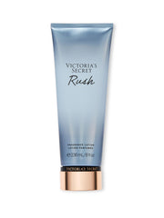 Victoria's Secret Rush Lotion bottle front with fast-absorbing, fruity gourmand scent.