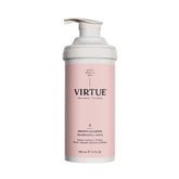 Virtue Smooth Shampoo bottle pouring, showcasing frizz-control lather benefits.
