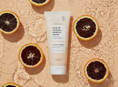VOESH Citrus Crush sugar scrub texture closeup showing gentle buffing.