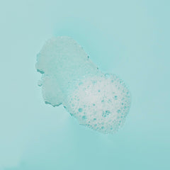 VOESH sugar scrub forming rich lather on skin.