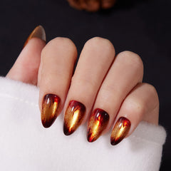 VSALON short almond nails with golden sparkly cat-eye flames for a chic look
