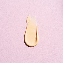 W7 Dewy Glow Drops applied with fingertips for a subtle cheek highlight.