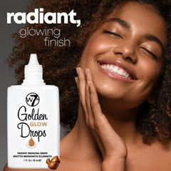 W7 Golden Glow Drops on hand showing buildable bronze finish