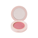 Wander Beauty hydrating powder blush Berry Busy swatch on skin for seamless blend.