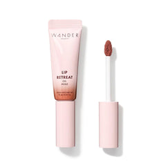 Wander Beauty Lip Retreat Oil Tan Lines bottle highlights nourishing tint for hydrated lips.