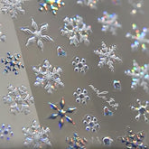 WBRRFJJ 5D embossed Christmas snowflake stickers close-up for festive nails.