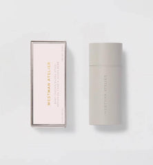 Application of Westman Atelier Baby Cheeks Blush Stick Coquette on cheek for glow