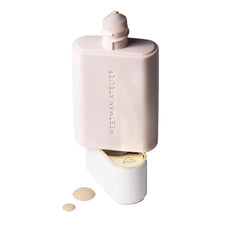 Westman Atelier Vital Skincare Complexion Drops bottle on vanity with soft glow