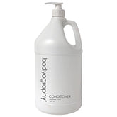 World Amenities Bodyography Blanc conditioner pump bottle for easy, mess-free application.