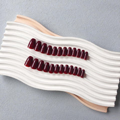 XCREANDO Burgundy Red Short Coffin Nails styled for a fashion-forward look