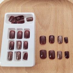 Close-up of Xenophoer burgundy press-on nails showing flexible base for fit