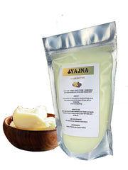 Yajna Cocoa Butter tub opened, creamy texture ideal for easy application.