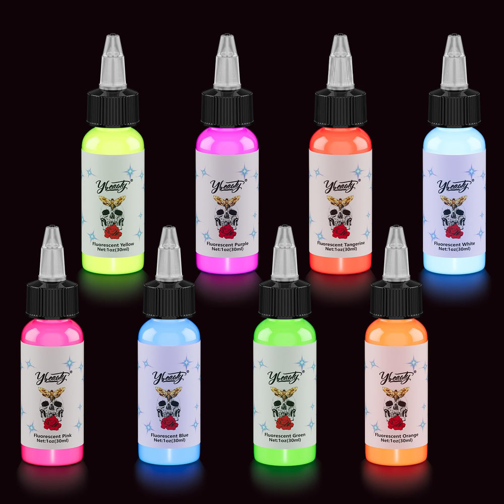 Ybeauty blue UV tattoo ink bottle glowing under UV light for vivid designs