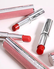 YNM Candy Gloss Balm bottle highlights plant oils for moisture