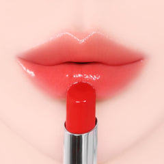 YNM Candy Gloss Balm glossy texture enhances smooth lips with soft color.