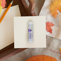 Young Living Lavender Lip Balm on lips demonstrates smooth, lasting moisture during daily activities.