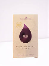 Young Living Valor moisturizing bar soap packaging in a bright bathroom scene, suggesting premium fragrance and care