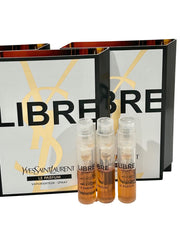 Three compact YSL Libre Le Parfum vials for travel and trial.