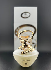 Zakat Parfums HALAYA bottle closeup shows embossed florals and a pearlescent finish