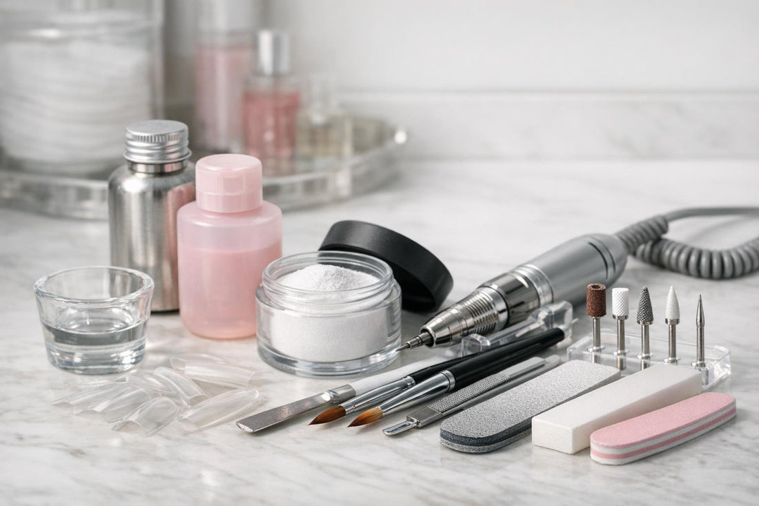 Professional acrylic nail tools laid out on table
