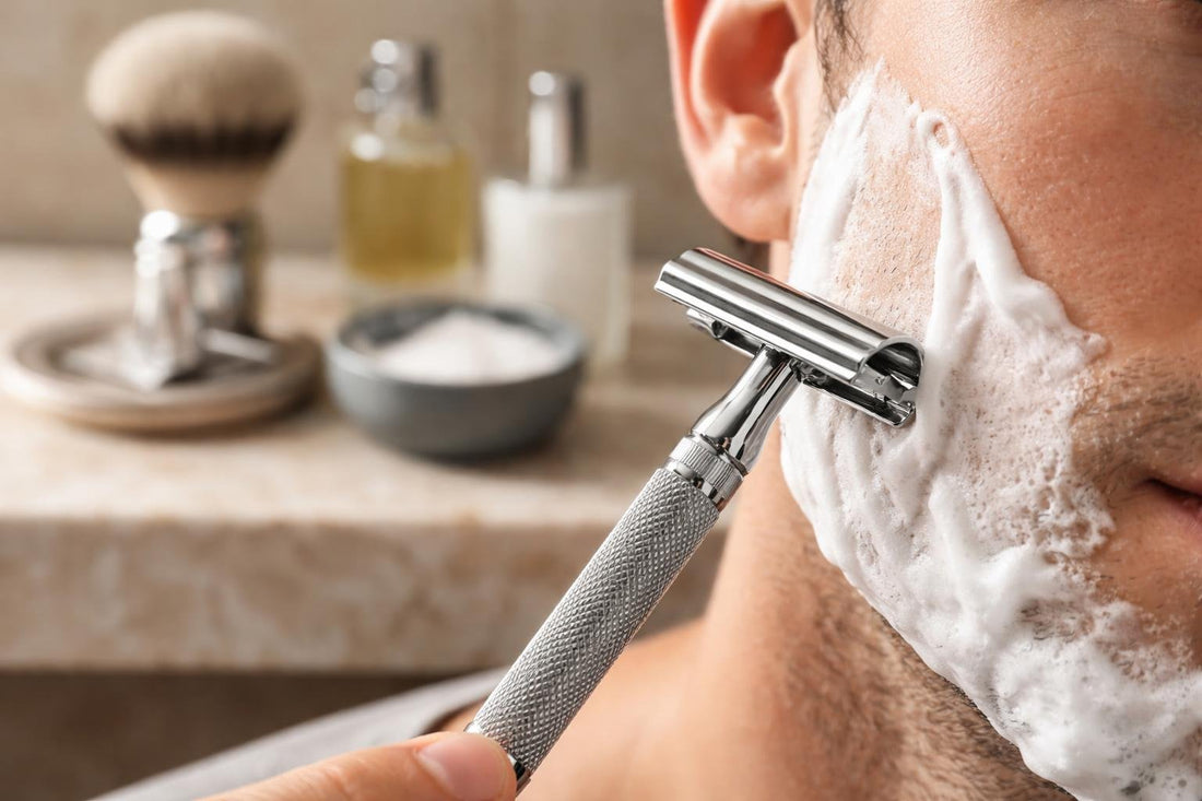Close-up men's safety shaving razor on skin