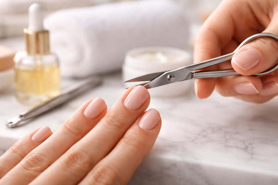 Professional cuticle scissors trimming a small hangnail safely