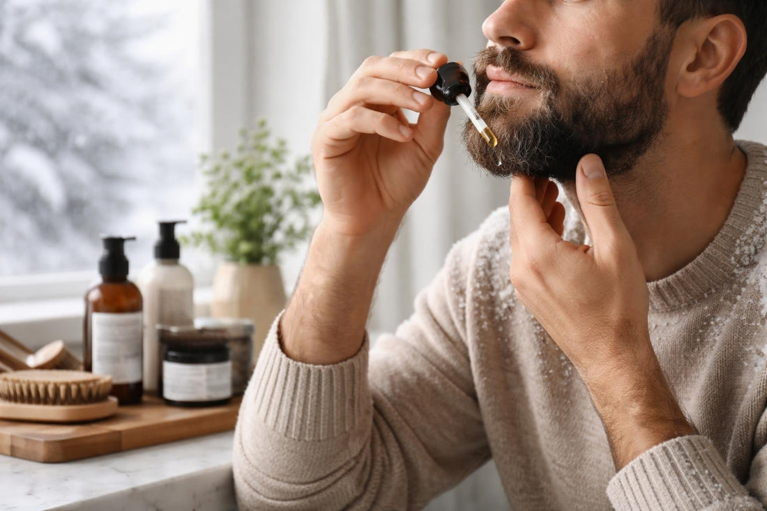 Man applying beard oil in winter for dryness relief