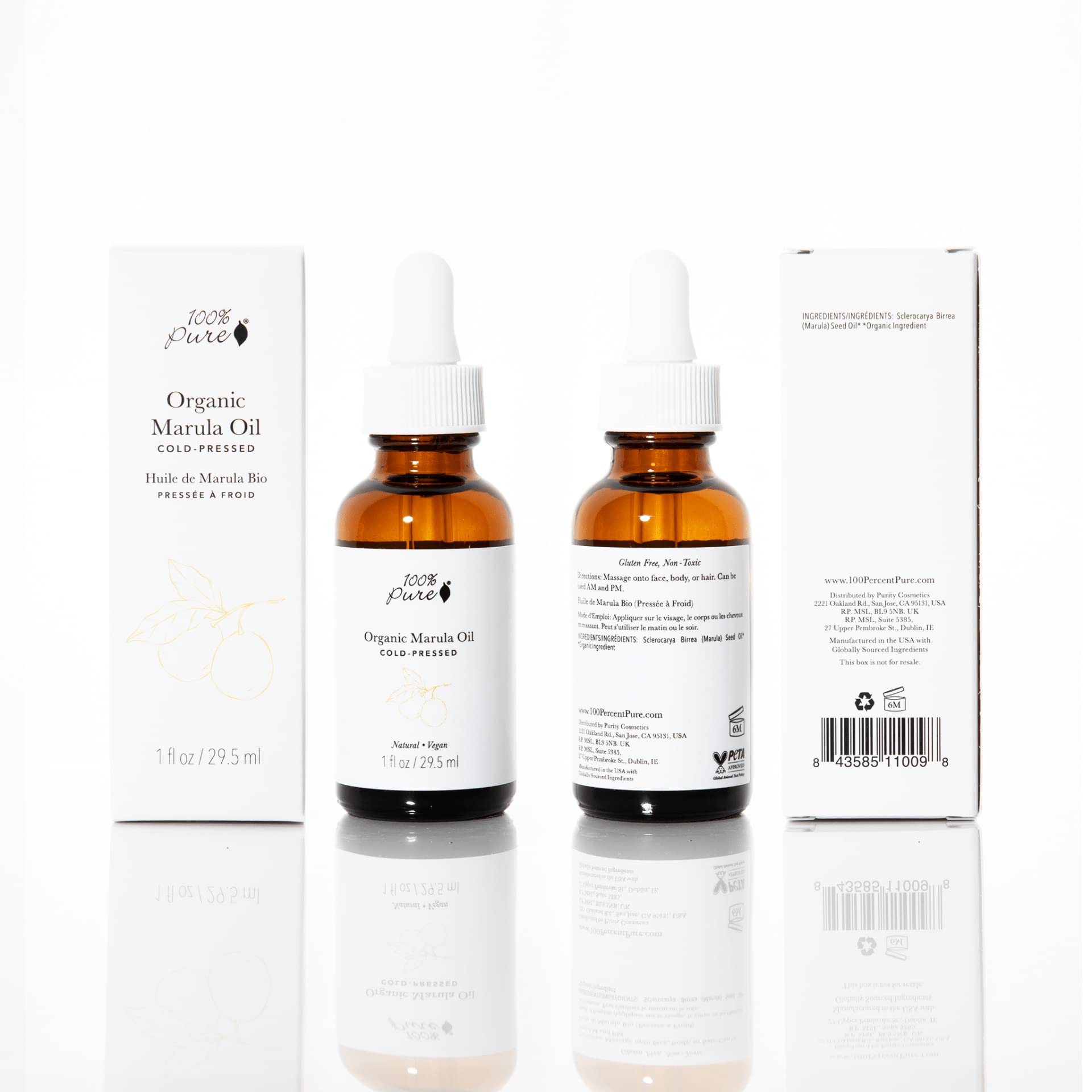 Closeup of 100% PURE Marula Oil label highlighting vegan, cold-pressed purity for radiant skin