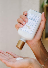 14th Night Nourishing Conditioner applying to mid-lengths for softness.