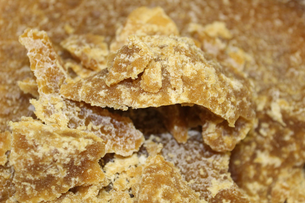 3CAYG Ucuuba Butter on hair strands for moisture retention.