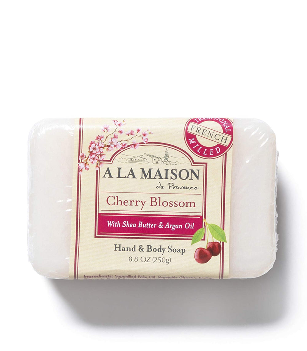 Hand with creamy lather using A La Maison Cherry Blossom soap.
