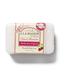 Hand with creamy lather using A La Maison Cherry Blossom soap.
