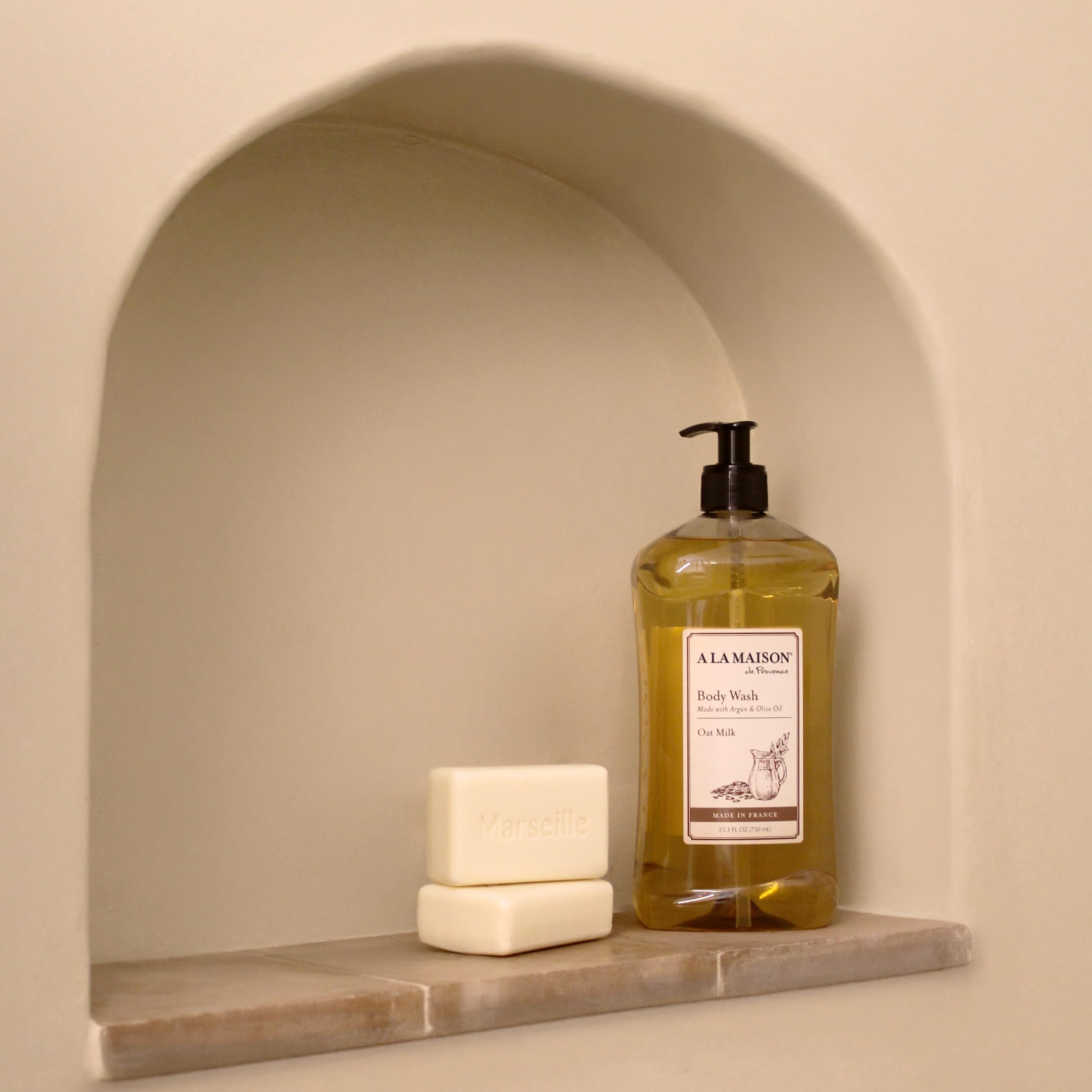 A LA MAISON Oat Milk Body Wash bathroom-setup suggests spa-like routine.