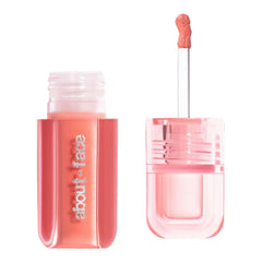 about-face Blush Rush bottle with pump for dewy, long-lasting color.