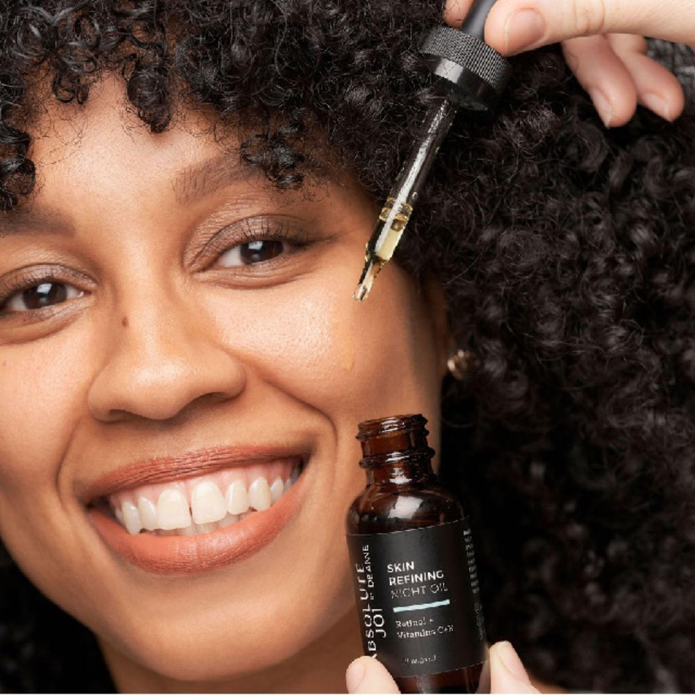 AbsoluteJOI serum dropper dispensing oil for precise nightly nourishment.