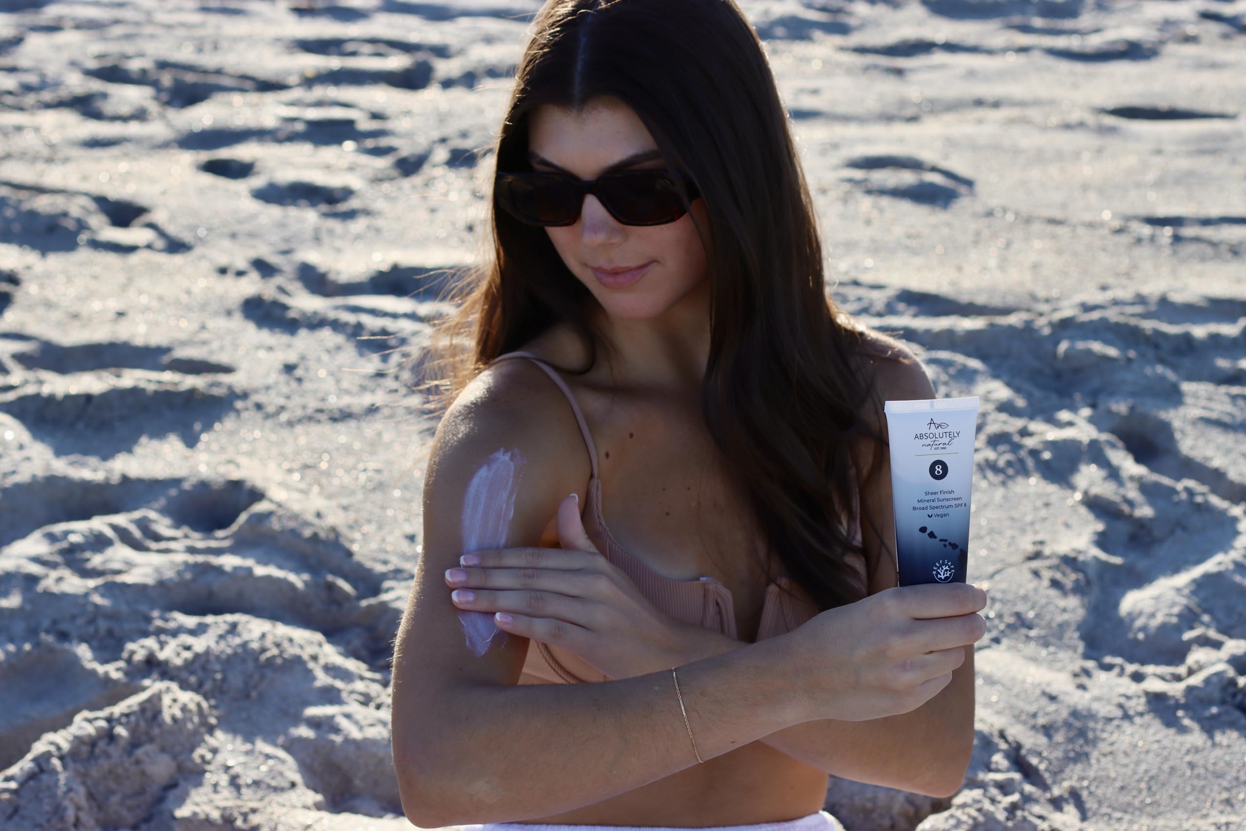 Absolutely Natural mineral sunscreen swatch on skin showing sheer protection.