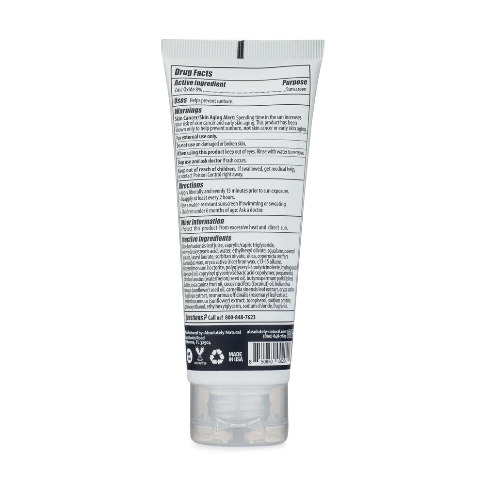 Absolutely Natural creamy sunscreen texture spread on skin.